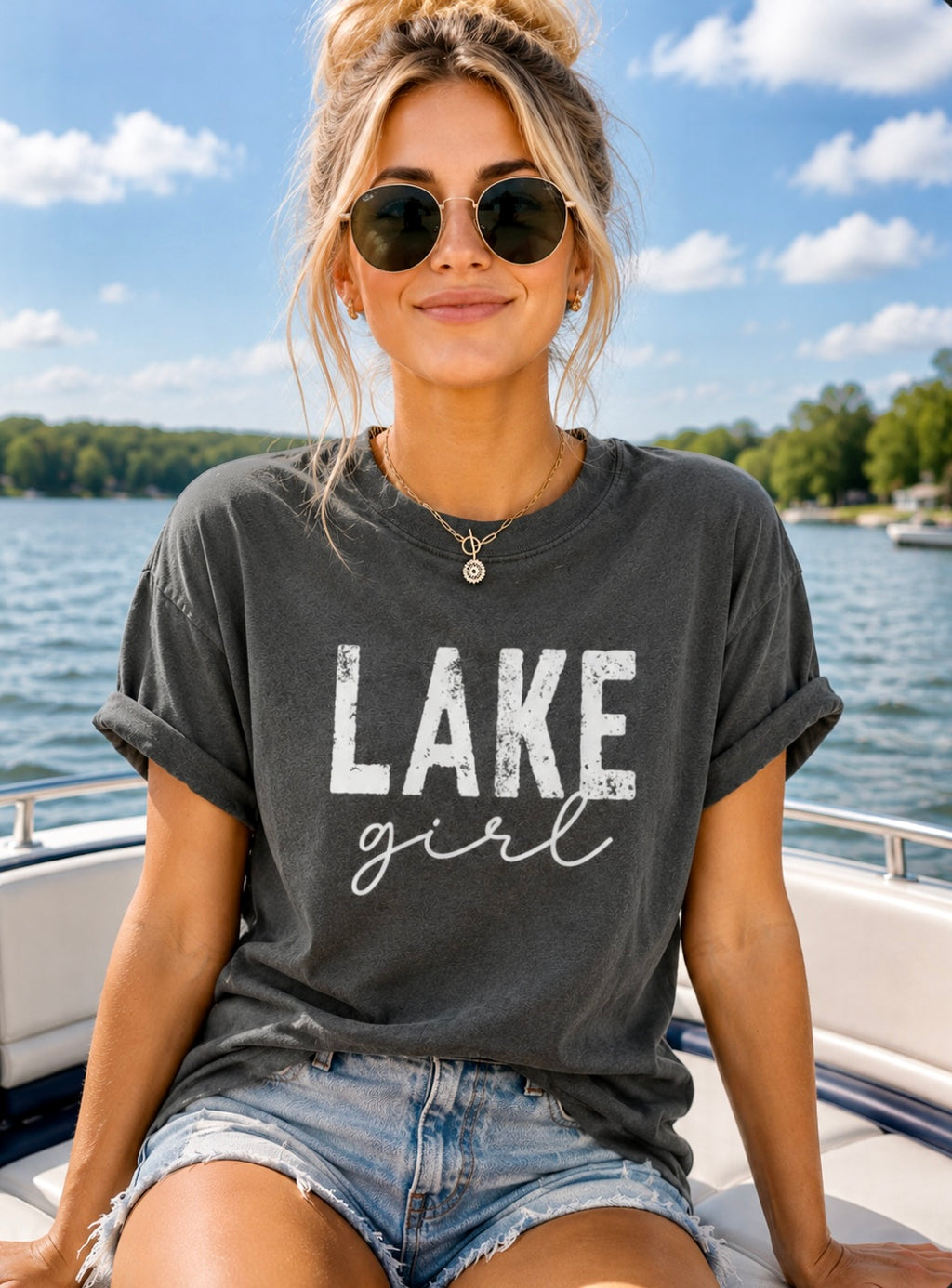 Woman wearing a 'Lake girl' t-shirt on a boat with a lake background