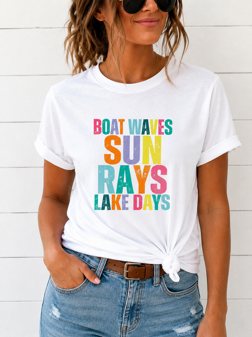 Woman wearing a white t-shirt with colorful text design on a white background