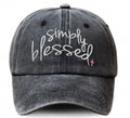 Black cap with 'Simply Blessed' text on a white background