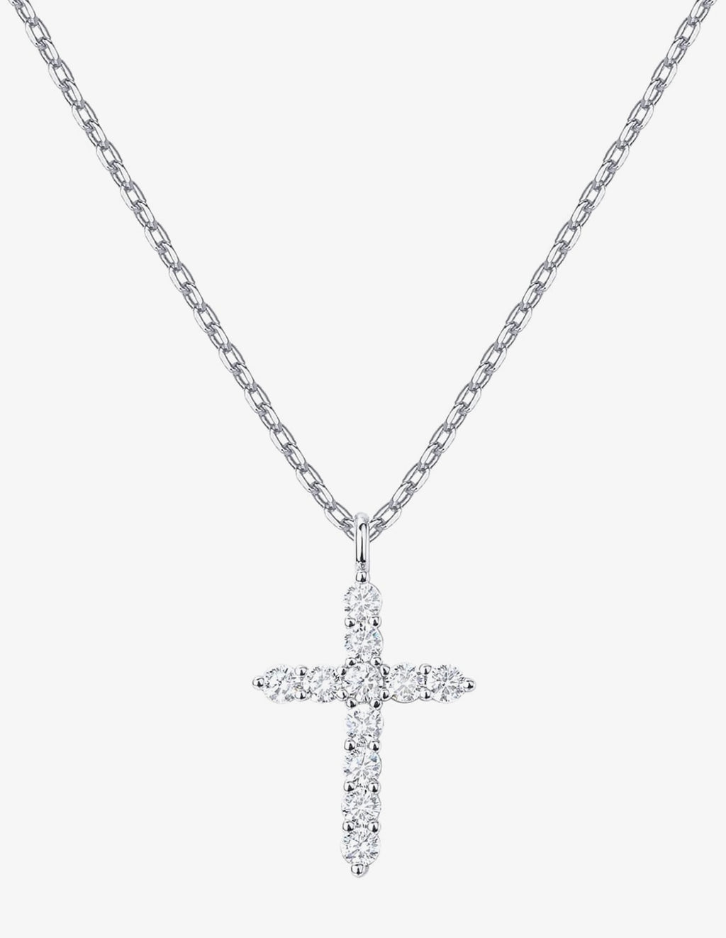 A silver cross pendant necklace paved with small clear stones, hanging from a silver cable chain against a light gray background.