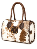 Upcycled Louis Vuitton cowhide handbag with brown braided handles, a brown leather LV monogram patch on the front, and whipstitched edges on a white background.