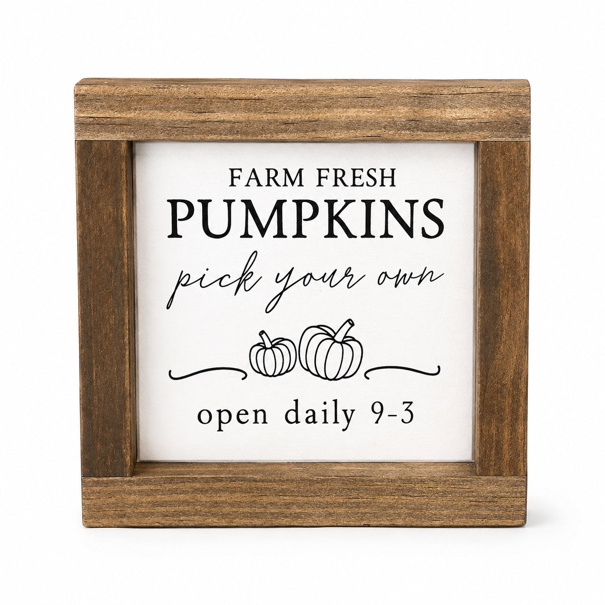 Square wooden sign with a white insert featuring the text 'FARM FRESH PUMPKINS pick your own open daily 9-3' and simple pumpkin illustrations, shown on a light gray background.