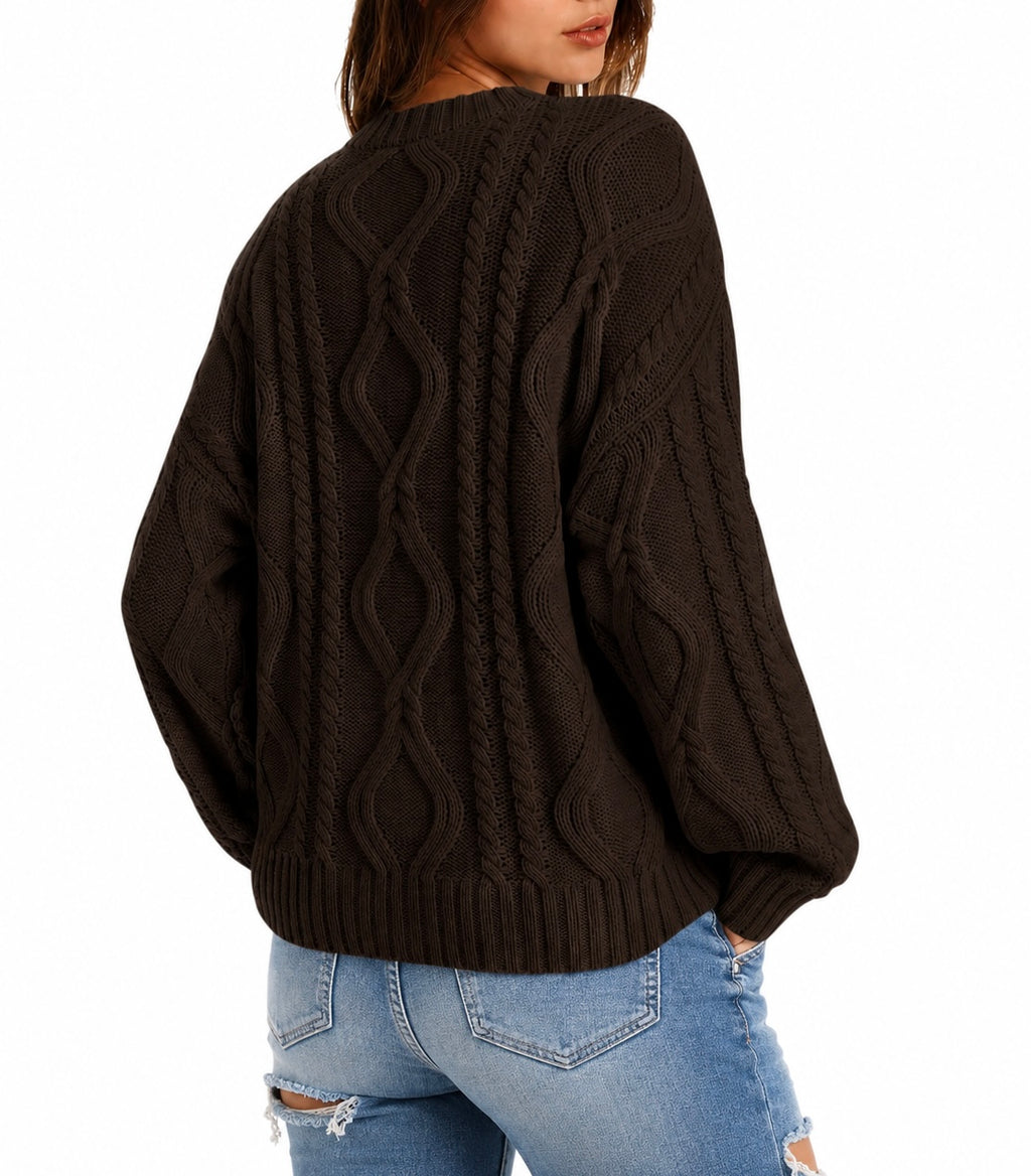 A woman wearing a dark brown cable-knit sweater, shown from the back, paired with light blue ripped jeans against a plain white background.