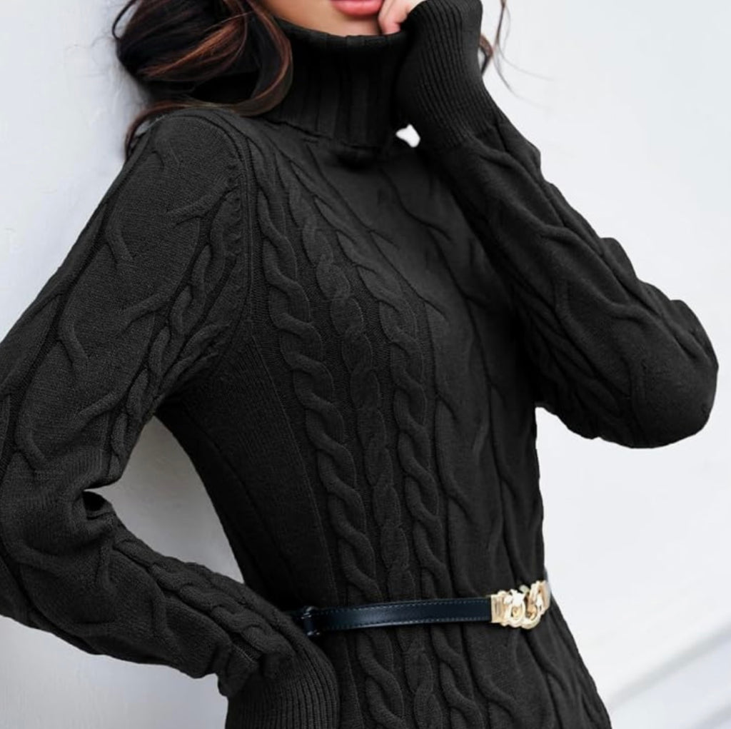 A close-up of a woman wearing a black cable-knit turtleneck sweater with a black belt featuring a gold-tone decorative buckle.